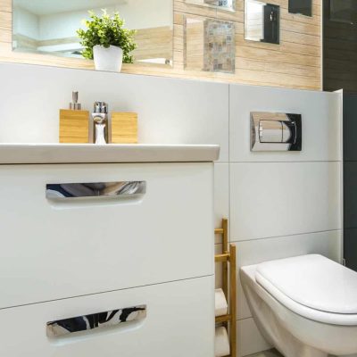 MINSK, BELARUS - toilet and detail of a corner shower cabin with wall mount shower attachment