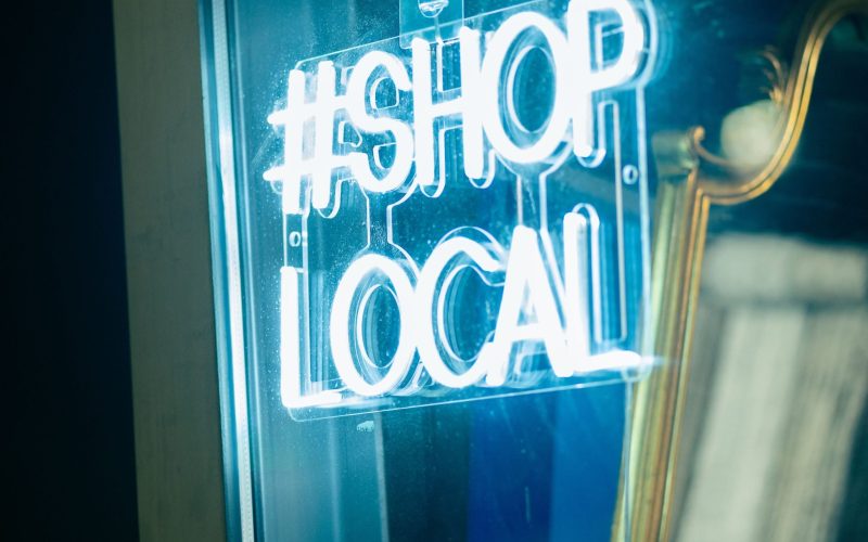 Closeup of blue neon lights for local shop text A closeup of blue neon lights for local shop text